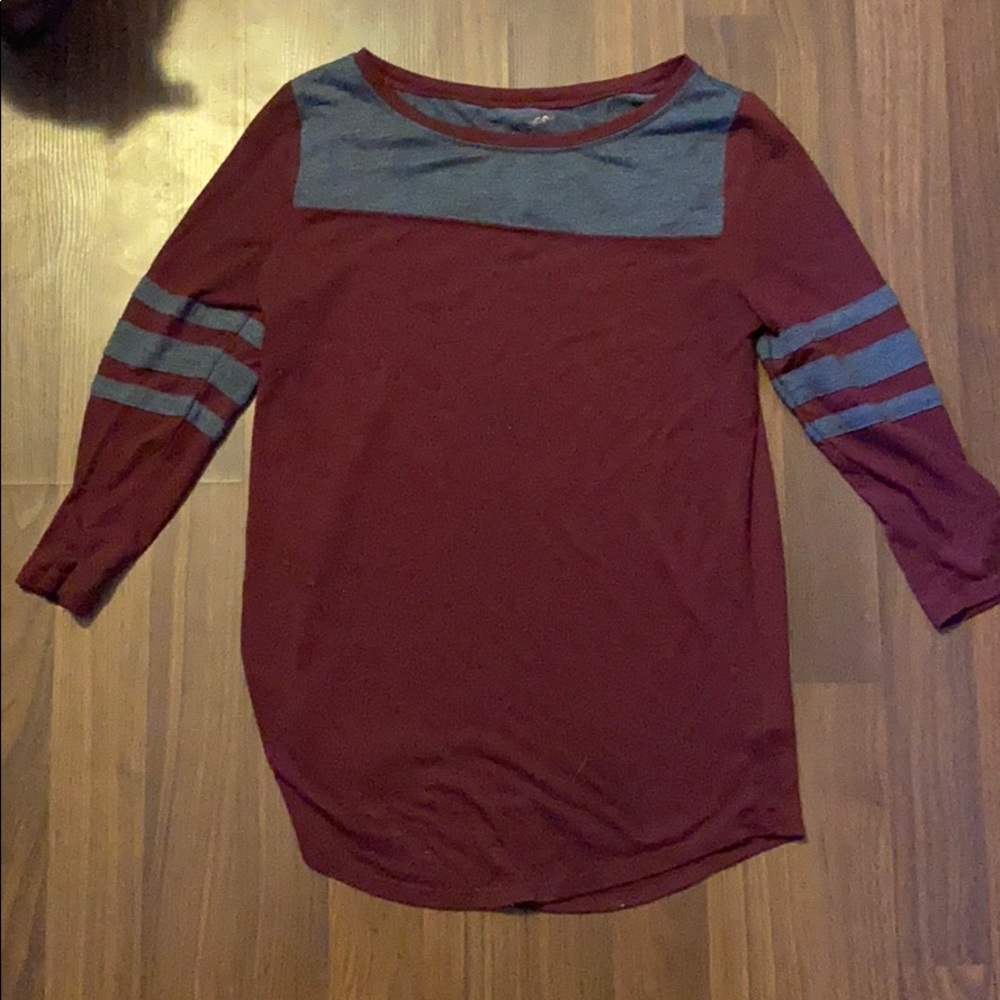 this is a maroon shirt with dark gray stripes